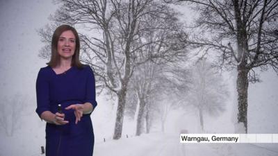 Presenter in front of snowy picture from Germany