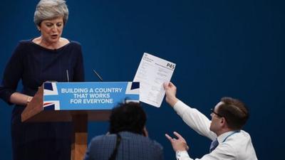 Simon Brodkin gives Theresa May P45