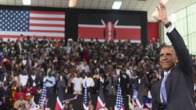 US President Barack Obama waves after speaking at Safaricom Indoor Arena in Nairobi