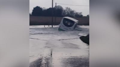 Bus driving through flood water