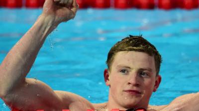 Great Britain's Adam Peaty celebrates winning the final of the men"s 50m breaststroke swimming event at the 2015 FINA World Championships in Kazan on August 5, 2015.