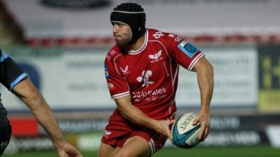 Leigh Halfpenny of Scarlets in action against Cardiff