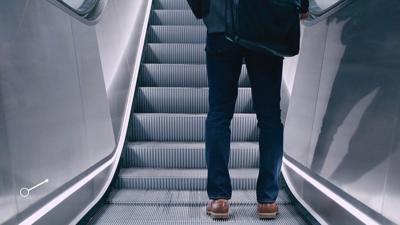 A person on an escalator