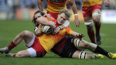 Edinburgh's Ben Toolis tackles Aled Davies of the Scarlets