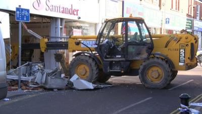 Digger in bank