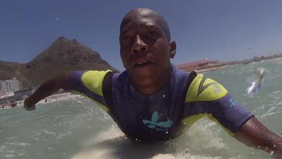 A man on a surf board