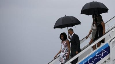 US President Barack Obama, his wife first lady Michelle, and their daughters Malia and Sasha, exit Air Force One as they arrive at Havana's international airport for a three-day trip, in Havana, Cuba on 20 March, 2016