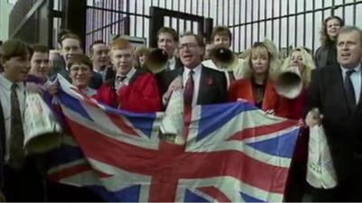 Supporters hold Union flag