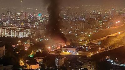 Smoke rising from Evin Prison