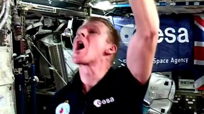 Tim Peake drinking water in space