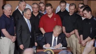 Donald Trump signing the Energy Independence Executive Order