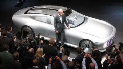 Dieter Zetsche poses with a Mercedes prototype model at the Frankfurt Motor Show