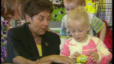 Gillian Shephard at a school with child