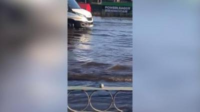 Van being driven through water