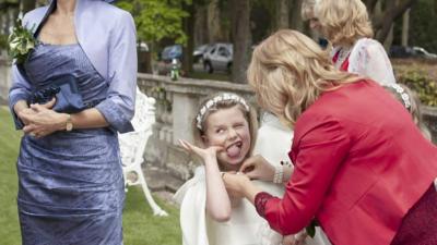 Little girl makes silly face