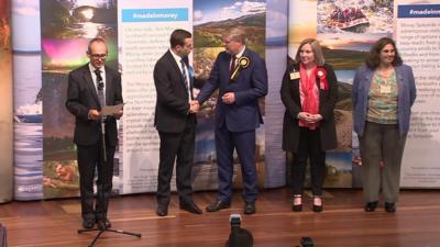 Douglas Ross and Angus Robertson shake hands