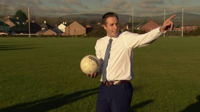 Paul Givan playing Gaelic football