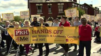 Protestors carrying banners on the march