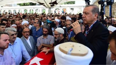 Turkish President Recep Tayyip Erdogan addresses the crowd after the funeral service for victims of the thwarted coup