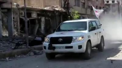 A ground convoy arrives in Darayya, Syria.