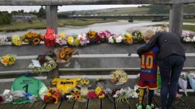 Floral tributes at crash scene