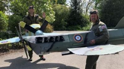 Men dressed as planes