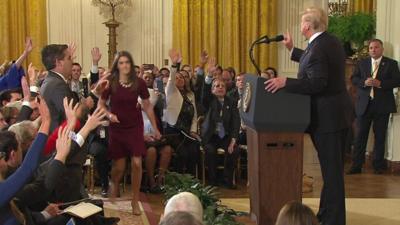 A White House staffer tries to grab CNN correspondent's microphone