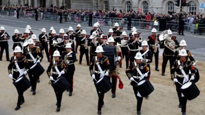 Members of a military marching band walk on the day of the state funeral and burial of Britain's Queen Elizabeth