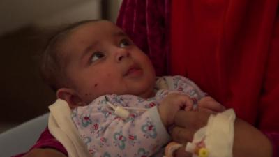 A baby being treated in the hospital.