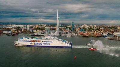 Ferry sailing past Spinnaker Tower