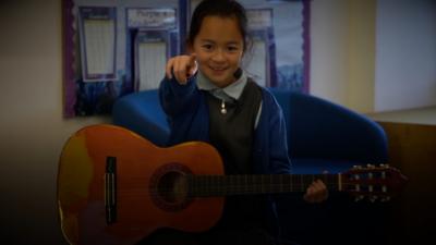 Child with guitar