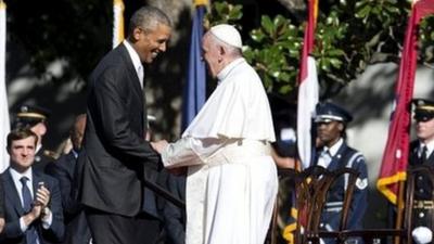 President Barack Obama and Pope Francis shake hands