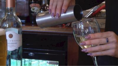 Wine poured behind bar