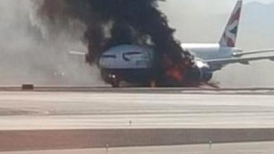 Plane ablaze on runway