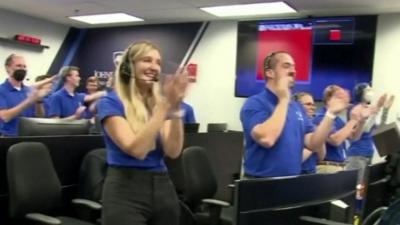 Nasa scientists clapping