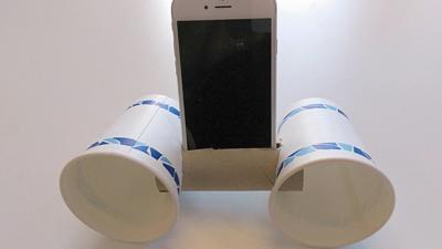 A smartphone speaker system made from a toilet roll and two cups