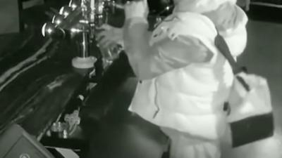 Burglar pouring a pint