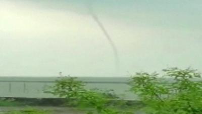 A waterspout over a bridge