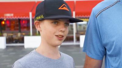 A young boy wearing a cap