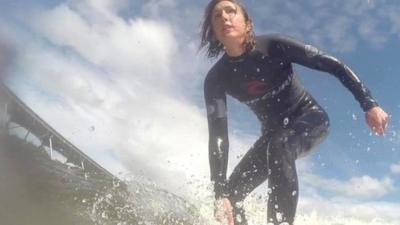 Claire Marshall surfing