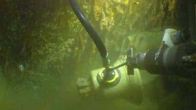 HMS Hood's bell being rescued from seabed