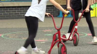 child plays in school playground