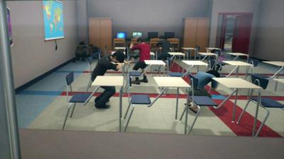 A computer simulation showing children hiding in a classroom