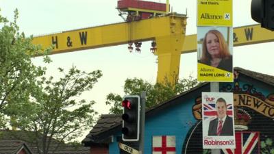 Election posters on a lamppost in the shadow of the Harland and Wolff cranes