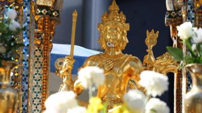 Bomb-damaged statue at shrine