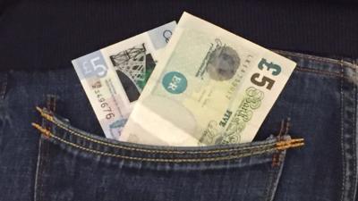 £5 notes in jeans pocket