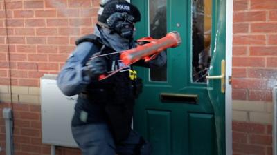 police officer with battering ram