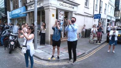 Members of the public in London clap for carers on 21 May 2020