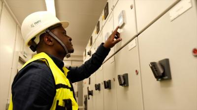 Archip Lobo examining equipment