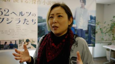 Erika Abiko speaking to camera